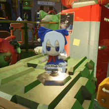 a stuffed doll with a blue bow sits in front of a space rio sign