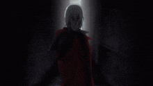 a man in a red coat is holding a gun
