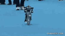 tiny robot riding a bike bike ride bicycle robot
