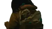 a person is carrying a cat in a backpack that says ' snoopy ' on it