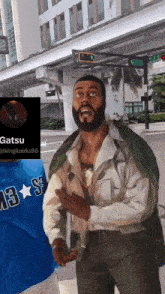 a painting of a man with a beard and a blue shirt that says ' gatsu ' on it