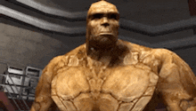 a close up of a statue of a man with a very muscular body in a room .