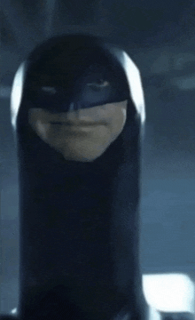 a close up of a person wearing a mask