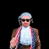 a man wearing a wig and sunglasses is waving his hand