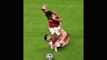 a soccer player wearing a red jersey with the number 30 on it