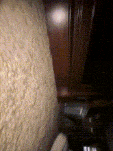 a blurred image of a wall with a few spots of light on it