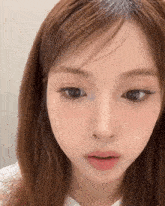 a close up of a woman 's face with her eyes closed and her mouth open