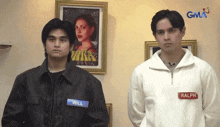 two men standing next to each other with one wearing a name tag that says will
