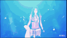 a gif of a woman dancing with the words gifs tortilla on the bottom right