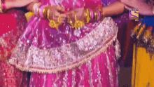 a woman in a pink dress is being shown on sony television