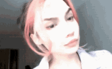a woman with red hair is taking a selfie