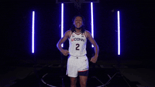 a female basketball player wearing a uconn jersey