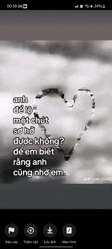 a black and white photo of a heart in the clouds with a quote in a foreign language