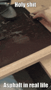 a person playing a video game with the words holy shit asphalt in real life on the bottom