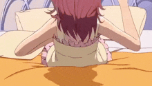 a girl with red hair is laying on a bed with her head on a pillow