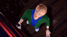 a boy in a green jacket and blue hoodie looks up at the camera