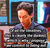 a man is looking at his phone with a caption that says of all the timelines , this is clearly the darkest