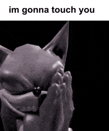 a black and white photo of a statue with the words `` im gonna touch you '' written on it .