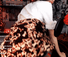 a leopard print skirt is being worn by a person