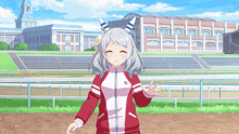 a girl in a red and white jacket with the letter w on it