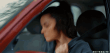 a woman in a car with editsmaite written on the bottom left