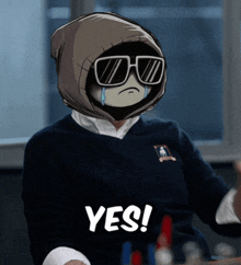 a person wearing sunglasses and a hoodie with the word yes on the bottom