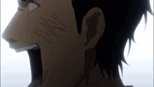 a close up of a person 's face with a few lines on it