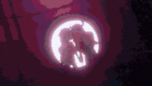 a couple of demons kissing in a circle in a purple light .