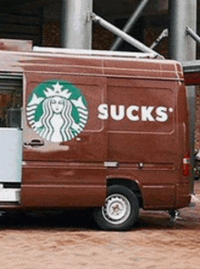 a starbucks van says sucks on the side of it