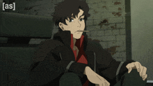 a man in a black jacket and red shirt is sitting in front of a brick wall with the words [ as ] on the bottom right