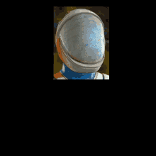 a close up of a person 's head with a helmet on .