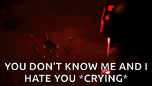 a person is crying in a dark room with the words `` you don t know me and i hate you * crying * '' .