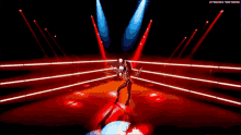 a woman is dancing in a dark room with a watermark that says thenextbig thing