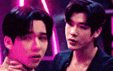 two young men are standing next to each other in a dark room with pink lights .