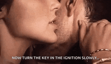 a man and a woman are kissing and the man is touching the woman 's neck .