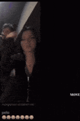 a man and a woman are having a video call and the man is wearing a black shirt with the word moncler on it