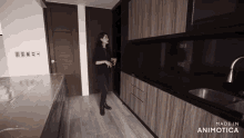 a woman standing in a kitchen with the words made in animatica on the bottom