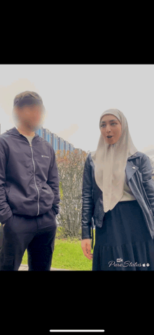 a man and a woman are standing next to each other and the man is wearing a columbia jacket