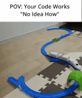 a picture of a toy train track with the caption " your code works no idea how "
