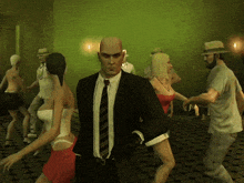 a man in a suit and tie is standing in a crowd of people