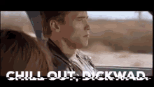 a man is sitting in a car with a woman and the words `` chill out , dickwad '' written above him .