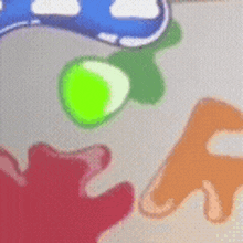 a close up of a painting with a green circle in the middle of it .