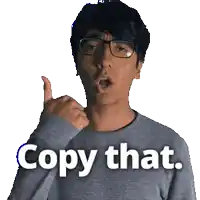 a man wearing glasses is giving a thumbs up and the words copy that are above him