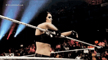 a woman in a wrestling ring with the words divas battle royal on the bottom right