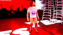 a wrestler wearing a white shirt that says ' the next big thing '