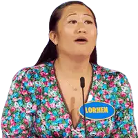 a woman with a name tag that says lormen is speaking into a microphone