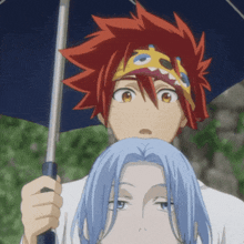 a man with red hair is holding an umbrella over another man with blue hair