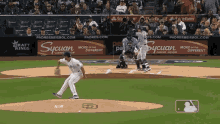 a baseball game is being played in front of an ad for sycuan casino resort