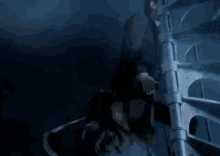 a dark blue background with a tower in the background