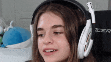 a girl wearing a pair of headphones that say 1cer